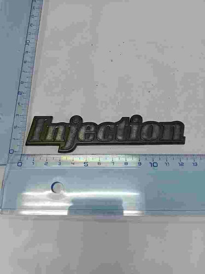 Emblema Renault R21 iniezione 13 cm. 7700774567 7700 774 567