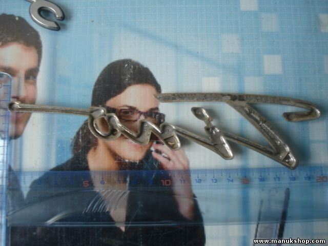 Emblema Nissan Almera Tino 90895BU300