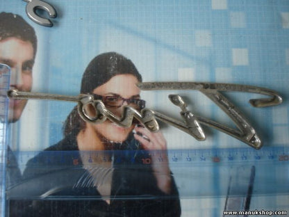 Emblema Nissan Almera Tino 90895BU300