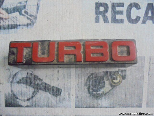 Emblema Nissan Terrano WD21 Ford Maverick TURBO 6289785G10