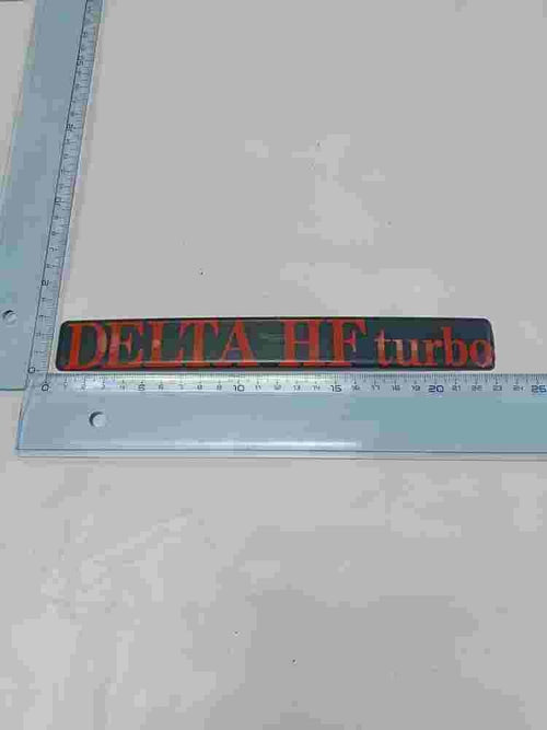 Emblema  Lancia Delta HF Turbo 23cm.