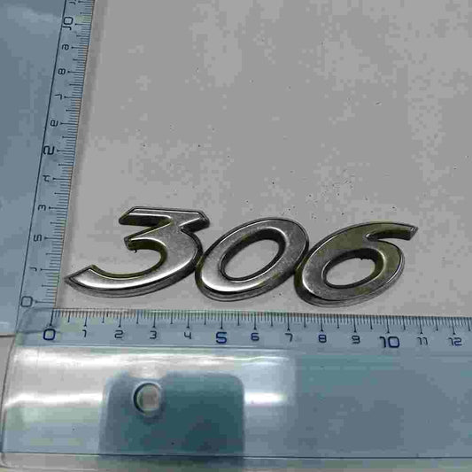 Emblema Peugeot 306 7706 1 ABS 10 cm.