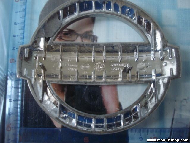 Emblema delantero Nissan Primera P12 65890AU300 65890 AU300 2002-2007